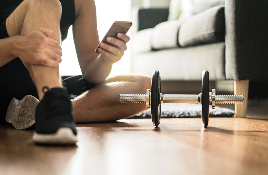 man on smartphone using fitness app